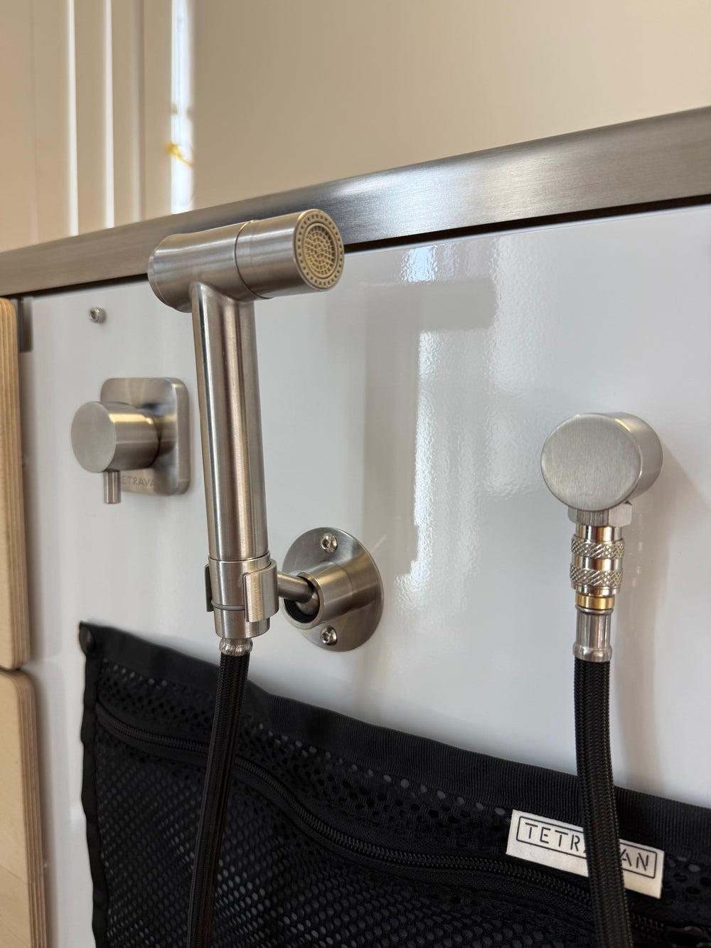 Close up of Tetravan Shower Port fixtures.