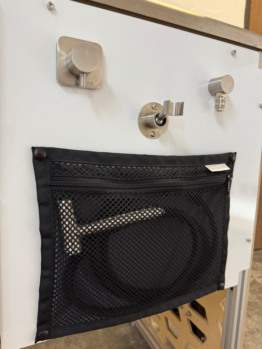 Tetravan shower port with snap on storage pouch